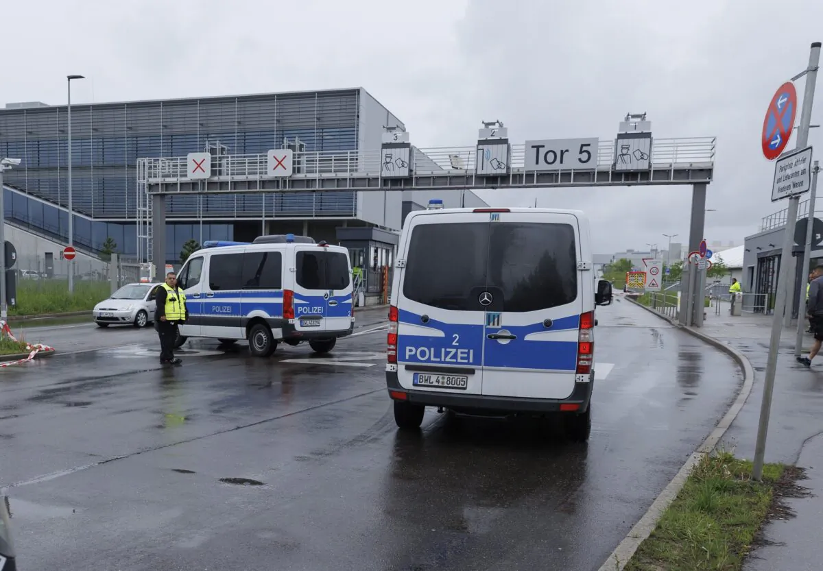 Police vehicles are parked in Sindelfingen, Germany, on May 11, 2023. (Julian Rettig/dpa via AP)