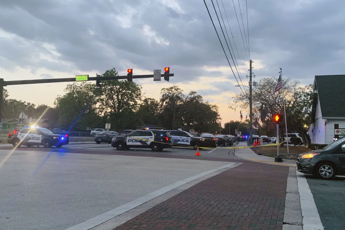 Police units block off 10th Street at Martin Luther King Jr. Avenue on May 10, 2023, after a shooting that wounded a Lakeland officer and a juvenile. (Sara Megan Walsh/The Ledger via AP)