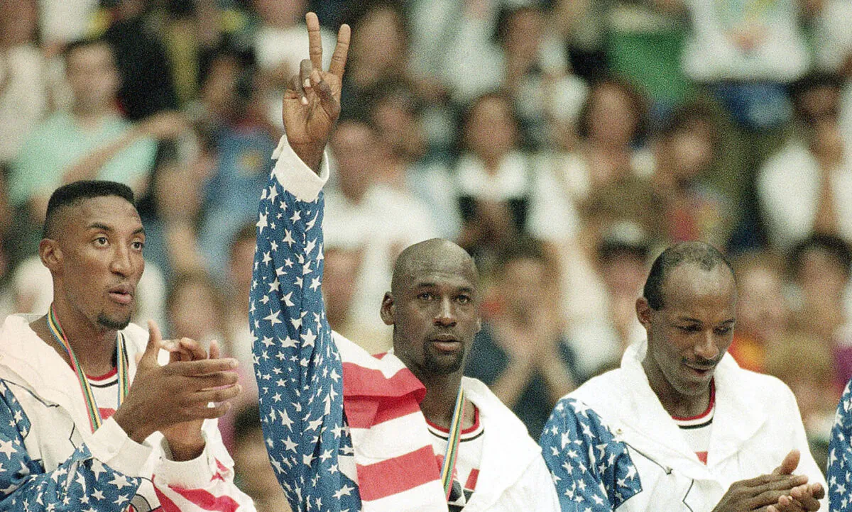 United States' Scottie Pippen (L), Michael Jorden (C), and Clyde Drexler rejoice in Olympic basketball in Barcelona, Spain, on Aug. 8, 1992, with their gold medals after beating Croatia, 117-85. (Susan Ragan/AP Photo)