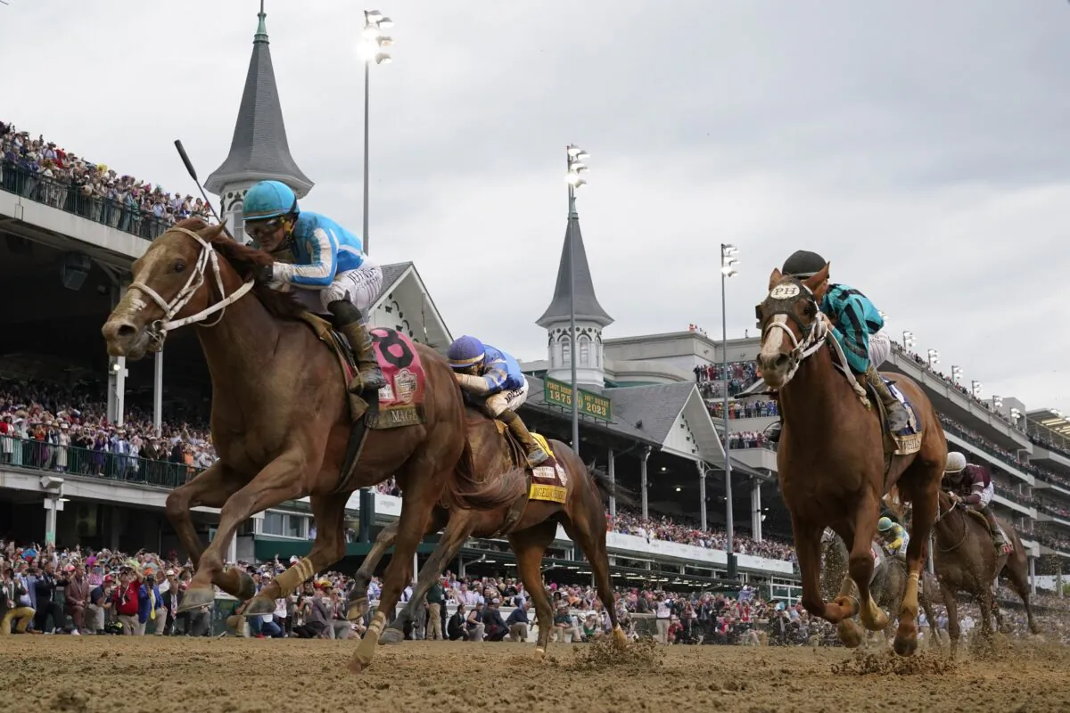 Mage (8) with Javier Castellano aboard wins the 149th running of the Kentucky Derby horse race at Churchill Downs in Louisville, Ky., on May 6, 2023. (Jeff Roberson/AP Photo)