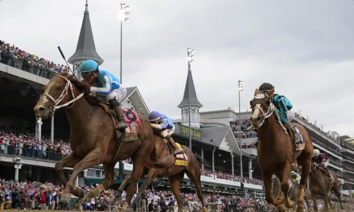 Mage (8) with Javier Castellano aboard wins the 149th running of the Kentucky Derby horse race at Churchill Downs in Louisville, Ky., on May 6, 2023. (Jeff Roberson/AP Photo)