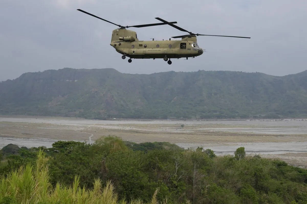 A U.S. Chinook helicopter passes by during a joint military exercise called "Balikatan", Tagalog for shoulder-to-shoulder, at Capas, Tarlac province, northern Philippines, on April 14, 2023. (Aaron Favila/AP Photo)