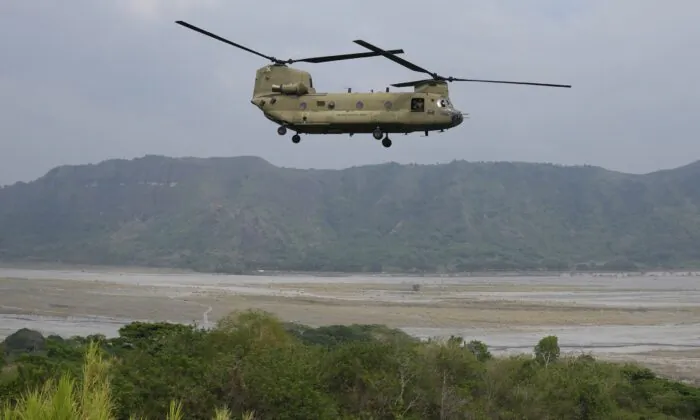 A U.S. Chinook helicopter passes by during a joint military exercise called "Balikatan", Tagalog for shoulder-to-shoulder, at Capas, Tarlac province, northern Philippines, on April 14, 2023. (Aaron Favila/AP Photo)