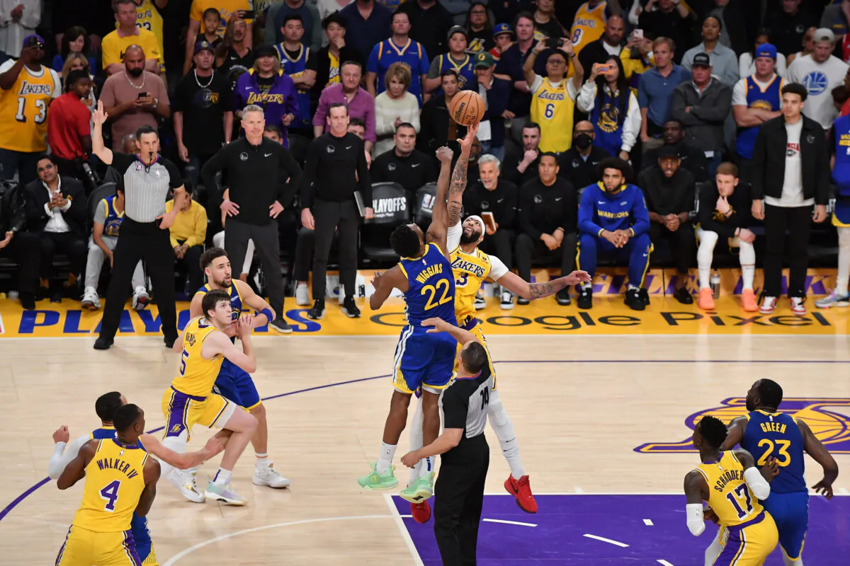 Anthony Davis (3) of the Los Angeles Lakers fights for a jump-ball against Andrew Wiggins (22) of the Golden State Warriors during Game Four of the Western Conference Semi-Finals of the 2023 NBA Playoffs in Los Angeles on May 8, 2023. (Allen Berezovsky/Getty Images)