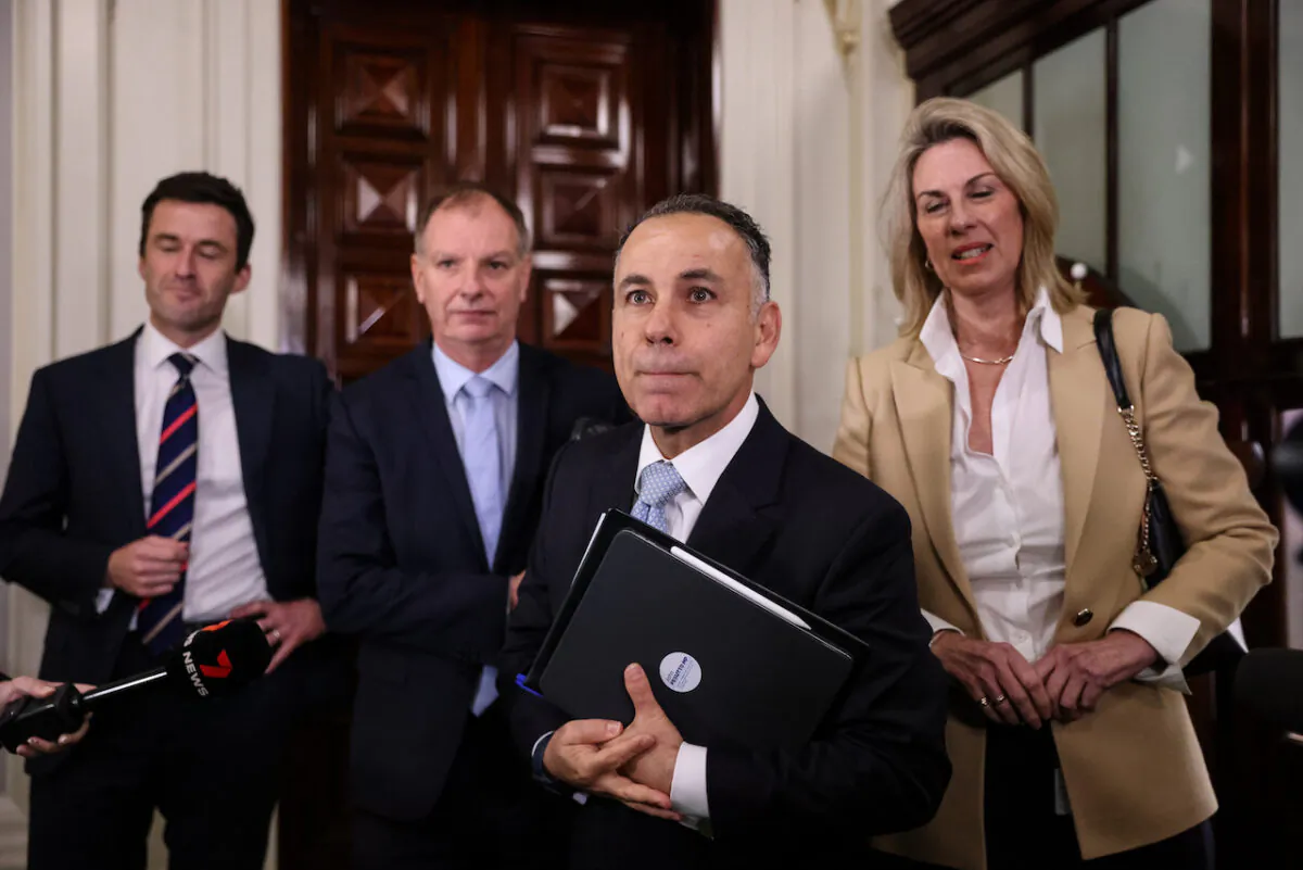 Victorian Opposition Leader John Pesutto (2nd R) leaves his party room at the Parliament of Victoria in Melbourne, Australia on May 12, 2023. (AAP Image/Diego Fedele)