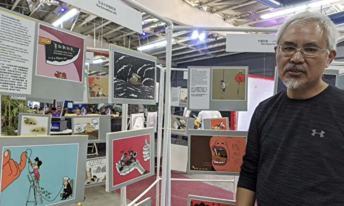 Zunzi, a well-known political cartoonist in Hong Kong, held his exhibitions in the City of Los Angeles in Nov 16, 2019. (Emma Hsu/The Epoch Times)