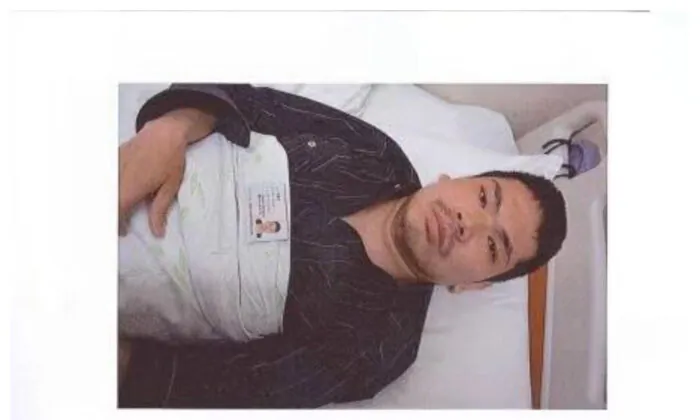  Lu Xiaozhong is pictured in an observing ward of Beijing Ditan Hospital on April 13, 2016, after he was injured by a thug from Shanghai Institute of Biological Products when he tried to file a complaint to Sinopharm petition office in Beijing about the tainted clotting factor VIII that caused various complications and generalized joint necrosis. (Courtesy of Lu Xiaozhong)