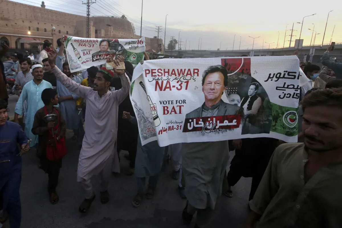 Supporters of Pakistan's former Prime Minister Imran Khan celebrate after Supreme Court decision in Peshawar, Pakistan, on May 11, 2023. (Muhammad Sajjad/AP Photo)