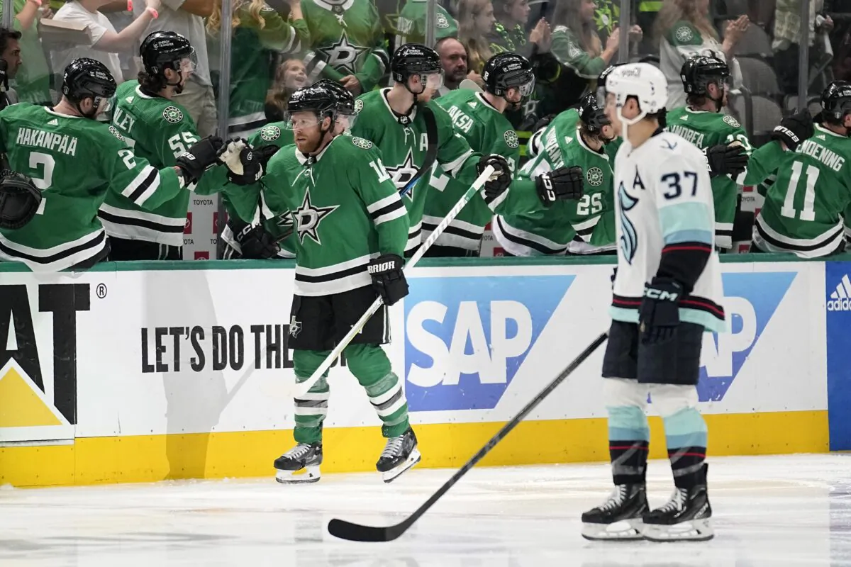 Dallas Stars' Joe Pavelski is congratulated for a goal, while Seattle Kraken's Yanni Gourde (37) skates past during the second period of Game 5 of an NHL hockey Stanley Cup second-round playoff series in Dallas on May 11, 2023. (Tony Gutierrez/AP Photo)