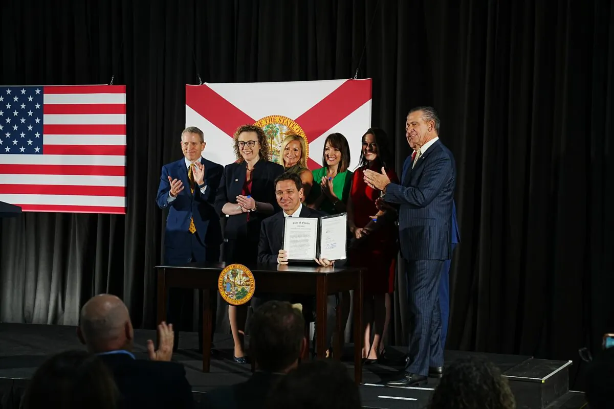 Florida Gov. Ron DeSantis signs legislation banning the financial industry's use of ESG principles on May 2. (Courtesy of the Florida Governor's Office.)