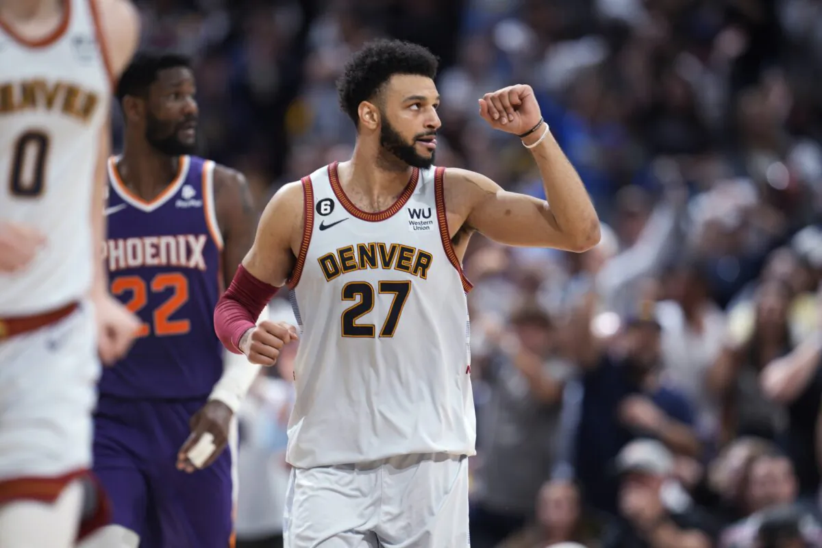 Denver Nuggets guard Jamal Murray gestures after hitting a 3-point basket against the Phoenix Suns during the second half of Game 5 of an NBA Western Conference basketball semifinal playoff series in Denver on May 9, 2023. (David Zalubowski/AP Photo)