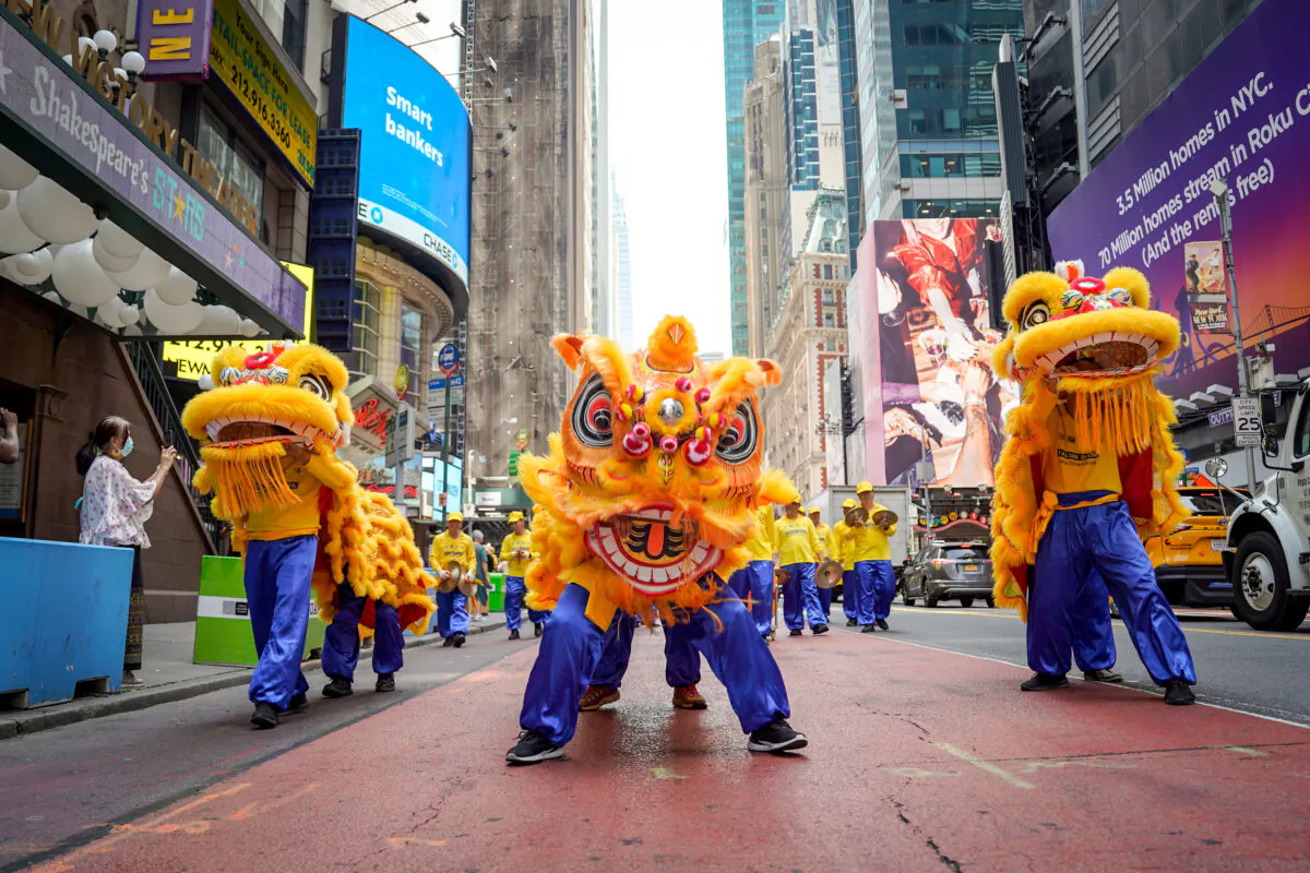 Falun Gong practitioners march in Manhattan to celebrate World Falun Dafa Day on May 12, 2023, in New York. (Samira Bouaou/The Epoch Times)