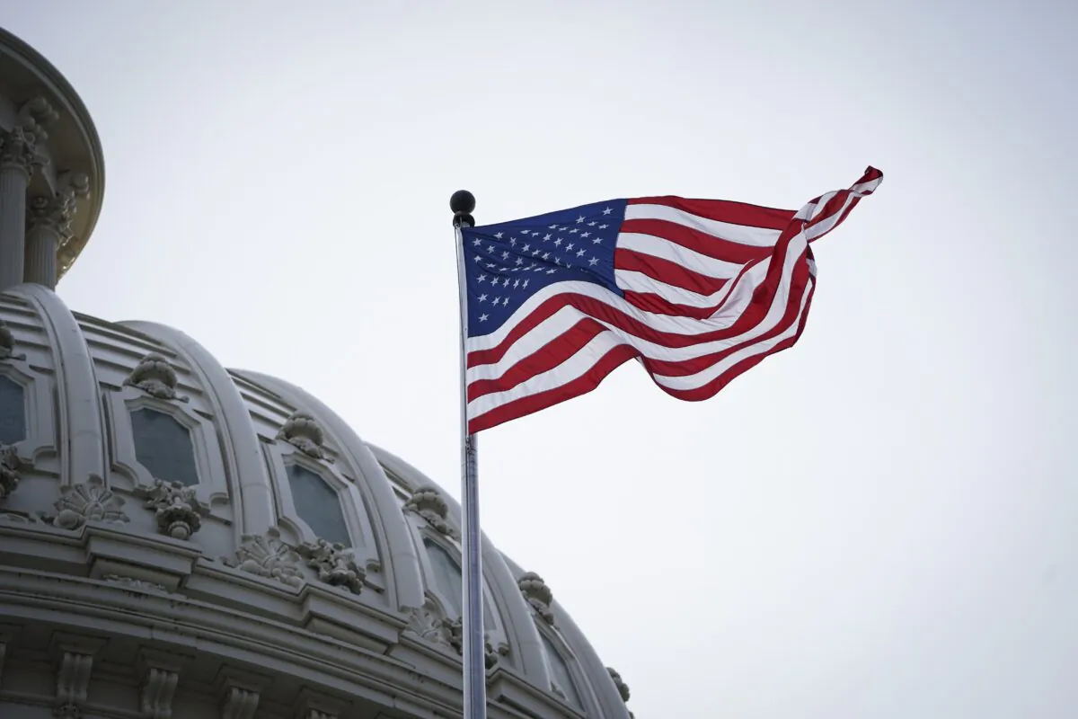 The United States flag at the dome of the U.S. Capitol building in Washington on May 12, 2023. (Madalina Vasiliu/The Epoch Times)