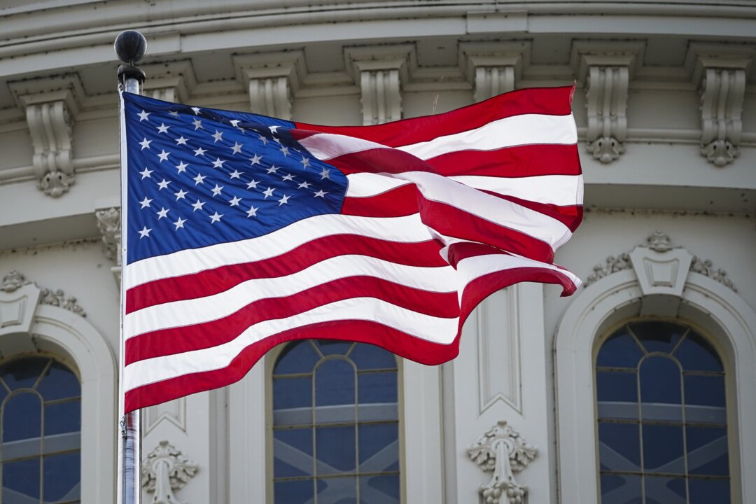 A United States flag flies at U.S. Capitol in Washington on May 12, 2023. (Madalina Vasiliu/The Epoch Times)