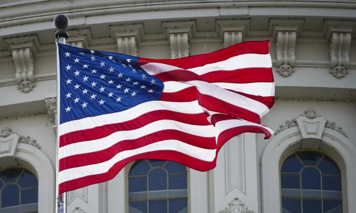 A United States flag flies at U.S. Capitol in Washington on May 12, 2023. (Madalina Vasiliu/The Epoch Times)