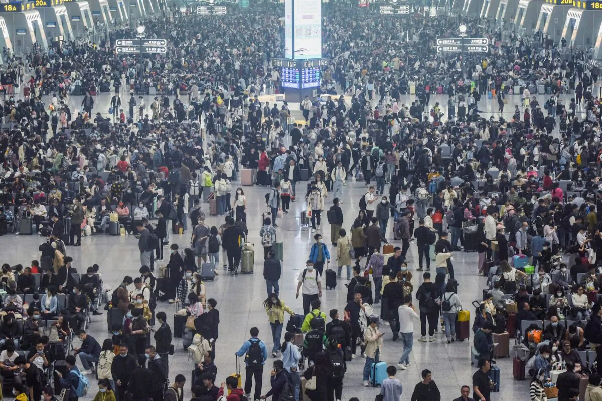 Passengers arrive at Hangzhou East train station in Hangzhou, in China's eastern Zhejiang Province, on April 28, 2023, ahead of the Labor Day holiday which started on April 29. (STR/AFP via Getty Images)