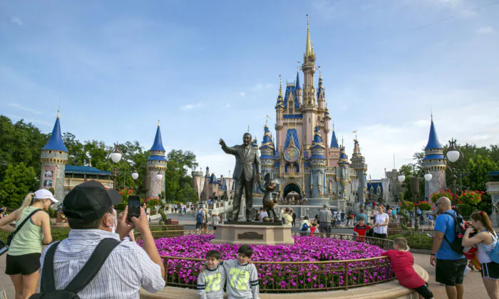 People visit the Magic Kingdom Park at Walt Disney World Resort in Lake Buena Vista, Fla., on April 18, 2022. (Ted Shaffrey/AP Photo)