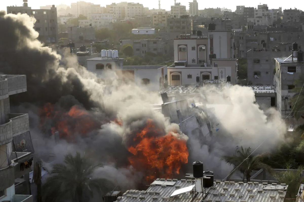 Smoke and fire rise from an explosion caused by an Israeli airstrike targeting a building in Gaza on May 13, 2023. (Ashraf Amra/AP Photo)