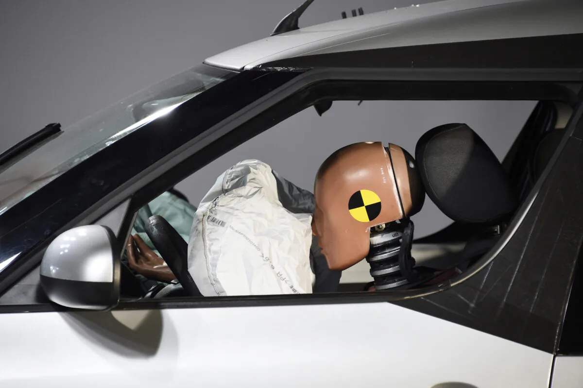 A car and its airbag are pictured after a frontal crash test with another car, without a safety belt buckled in the back seat, as part of France's Road Safety Commission's campaign "Buckle your seat belt, be attached to life" on Nov. 7, 2017. (BERTRAND GUAY/AFP via Getty Images)