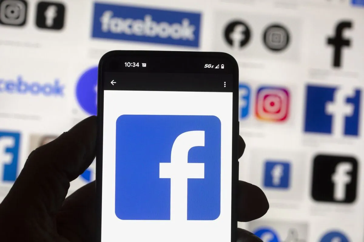 The Facebook logo is seen on a cell phone, Oct. 14, 2022, in Boston. (The Canadian Press/AP, Michael Dwyer)
