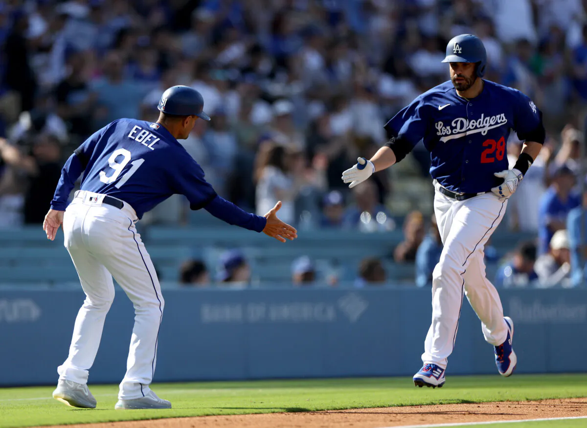 J.D. Martinez (28) of the Los Angeles Dodgers celebrates his solo homerun with Dino Ebel (91), to take a 3–1 lead over the San Diego Padres, during the first inning at Dodger Stadium in Los Angeles on May 13, 2023. (Harry How/Getty Images)