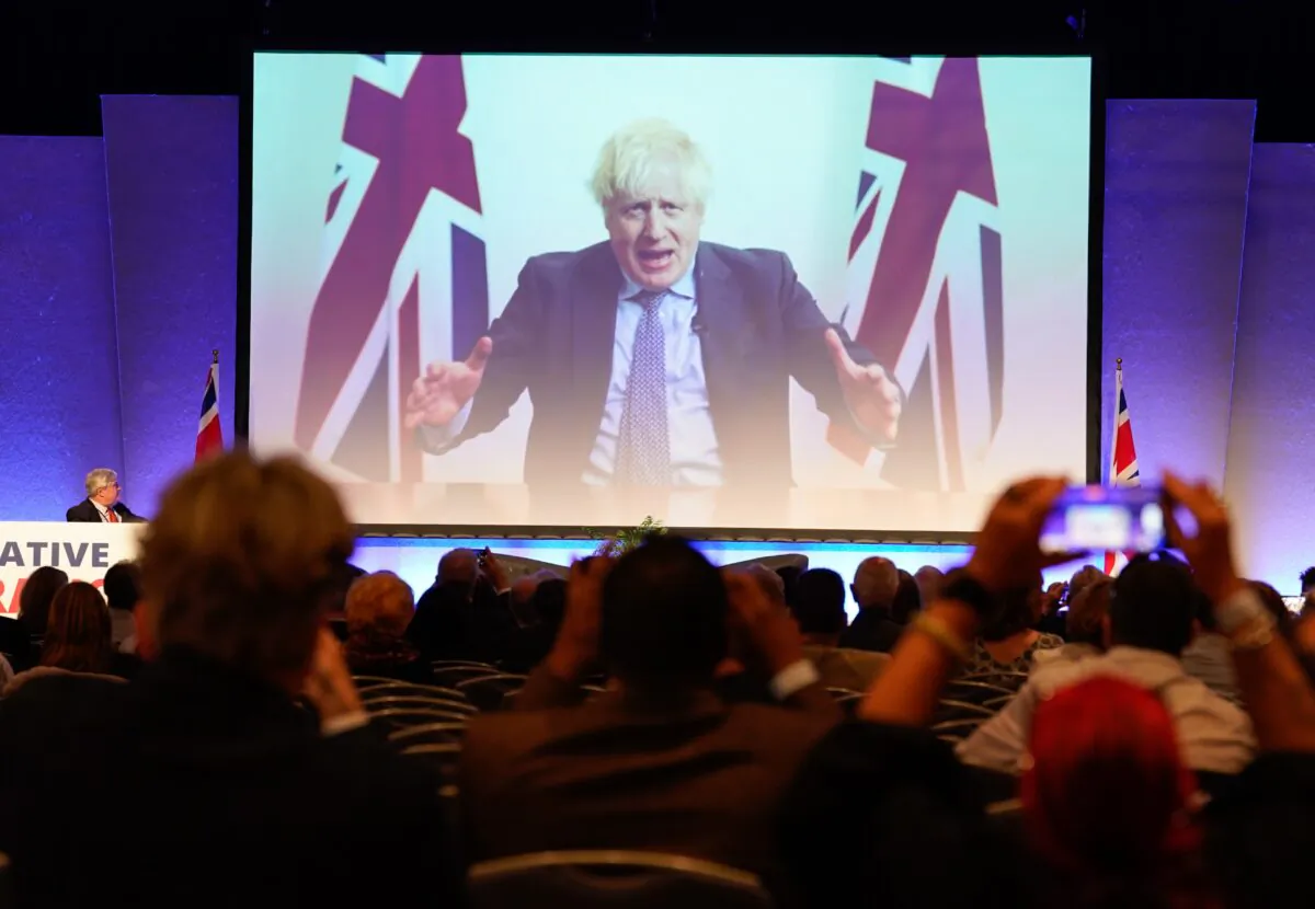 A video message from former Prime Minister Boris Johnson is played during the Conservative Democratic Organisation conference at Bournemouth International Centre, in Bournemouth, England, on May 13, 2023. (Andrew Matthews/PA Media)