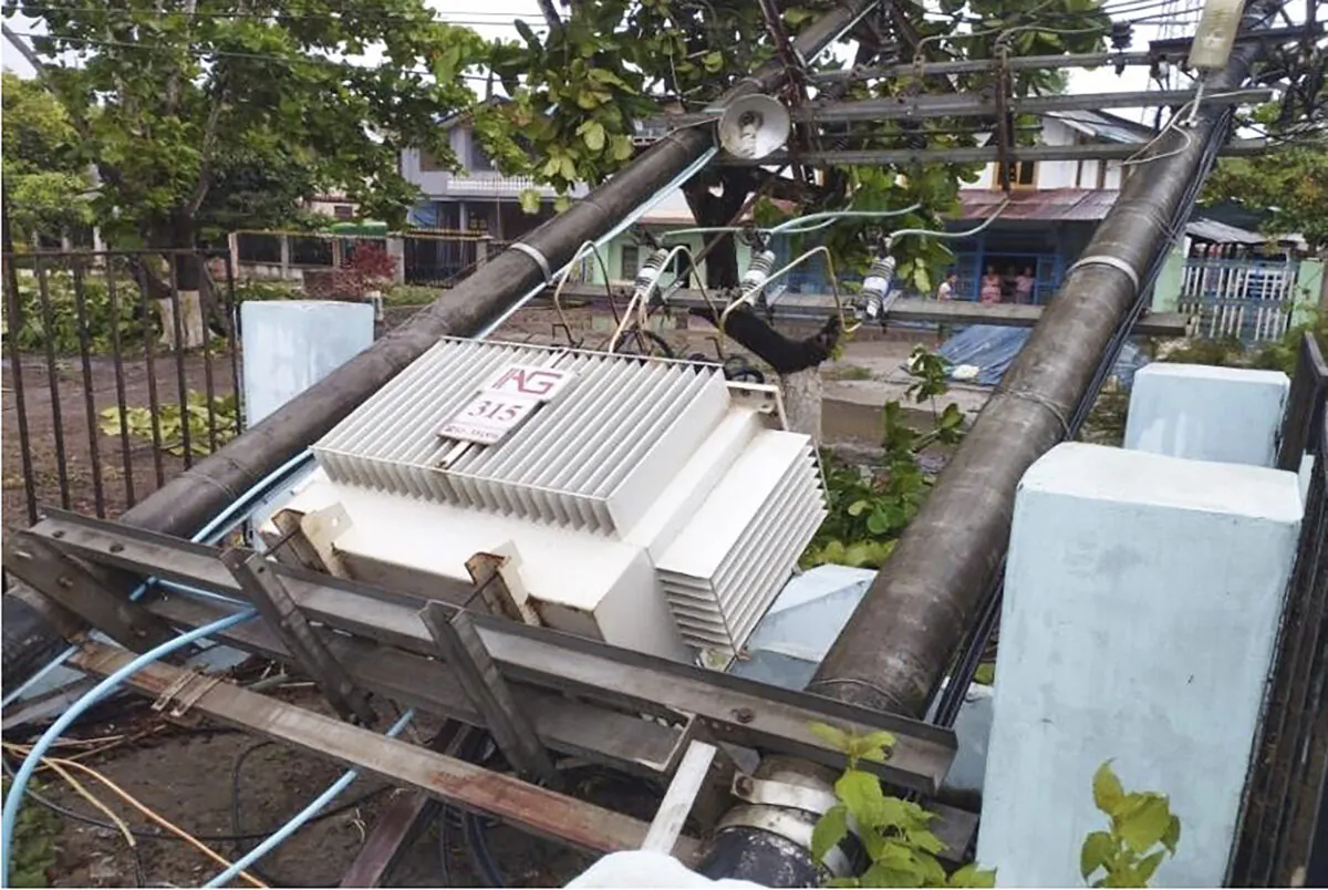 A lamppost attached with electrical transformer is damaged by Cyclone Mocha lines on a street in Gwa township, Rakhine State, Burma, in a photo provided on May 14, 2023. (Military True News Information Team via AP)