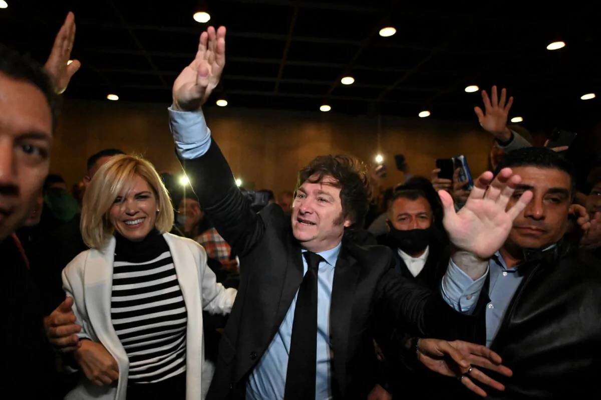 Argentine congressman Javier Milei waves to his supporters during the presentation of his book "El Camino del Libertario" at the Buenos Aires International Book Fair on May 14, 2022. (Photo by Luis Robayo / AFP via Getty Images)