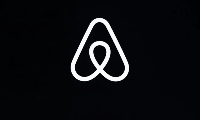 This Feb. 22, 2018, file photo, shows an Airbnb logo during an event in San Francisco. (The Associated Press/Eric Risberg)