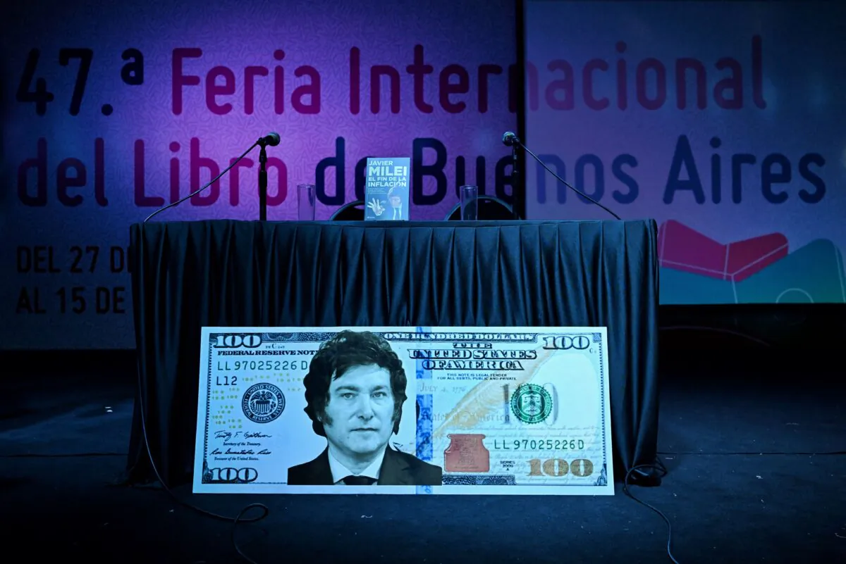 A giant US $100 bill with the face of Argentine congressman Javier Milei is seen before the presentation of his book "El fin de la inflación" (The end of inflation) at the Buenos Aires International Book Fair, on May 14, 2023. (Luis Robayo/AFP via Getty Images)