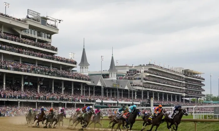 Horses come through the first turn during the 149th running of the Kentucky Derby horse race at Churchill Downs in Louisville, Ky., on May 6, 2023. (Julio Cortez/AP Photo)