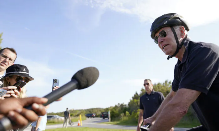 President Joe Biden speaks to members of the media as he goes on a bike ride in Gordons Pond State Park in Rehoboth Beach, Del., on May 14, 2023. (Carolyn Kaster/AP Photo)