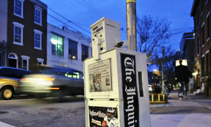 A Philadelphia Inquirer newspaper vending machine stands in Philadelphia on Nov. 30, 2006. (Matt Rourke/AP Photo)