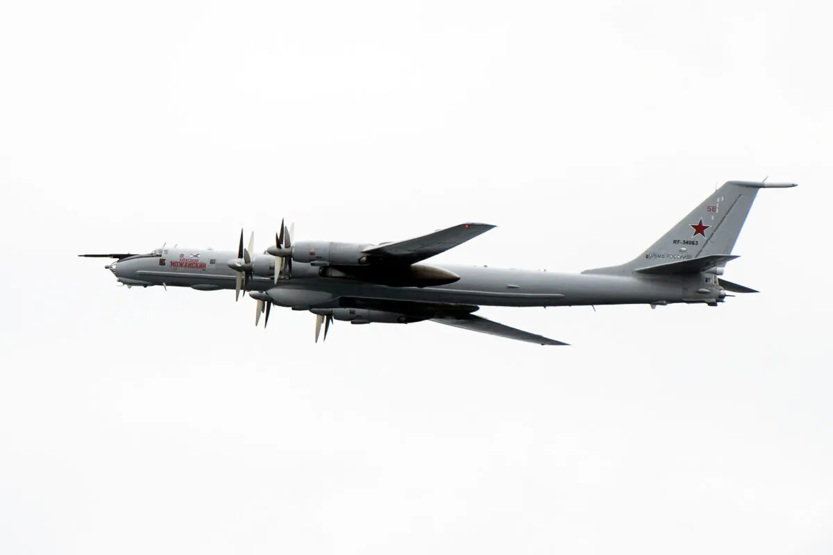 A Russian Tupolev TU-142 flies by the USS Mount Whitney of the U.S. Navy during the NATO-led military exercise Trident Juncture at the Norwegian sea outside Trondheim, Norway, on Nov. 2, 2018. (Jonathan Nackstrand/AFP via Getty Images)