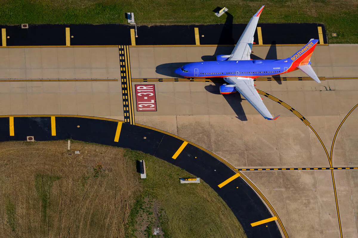 A Southwest Airlines 737-7H4 holds short of the 13L-31R runway at Dallas Love Field. (Smiley N. Pool/Dallas Morning News/TNS)