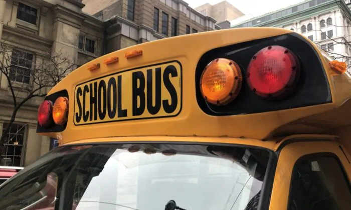 A school bus sits idle on Adelaide St., in Toronto, Jan. 17, 2023. (The Canadian Press/Tammy Hoy)