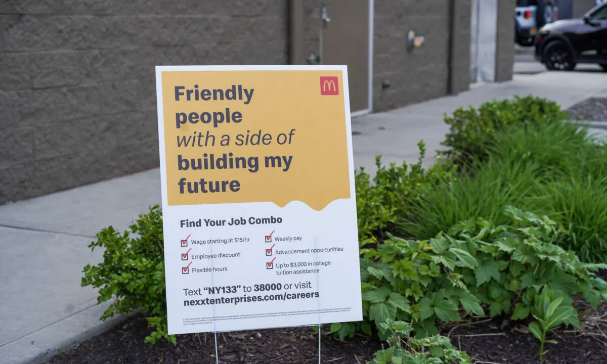 A hiring sign outside a McDonald's store on Route 211 in Middletown, N.Y., on May 15, 2023. (Cara Ding/The Epoch Times)