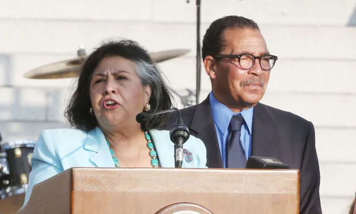 Former supervisor Gloria Molina (L) and former council president Herb Wesson speak during President Bill Clinton Pays Tribute to Mayor Antonio Villaraigosa at Celebrate LA! in Los Angeles, on June 7, 2013.  (Frederick M. Brown/Getty Images)