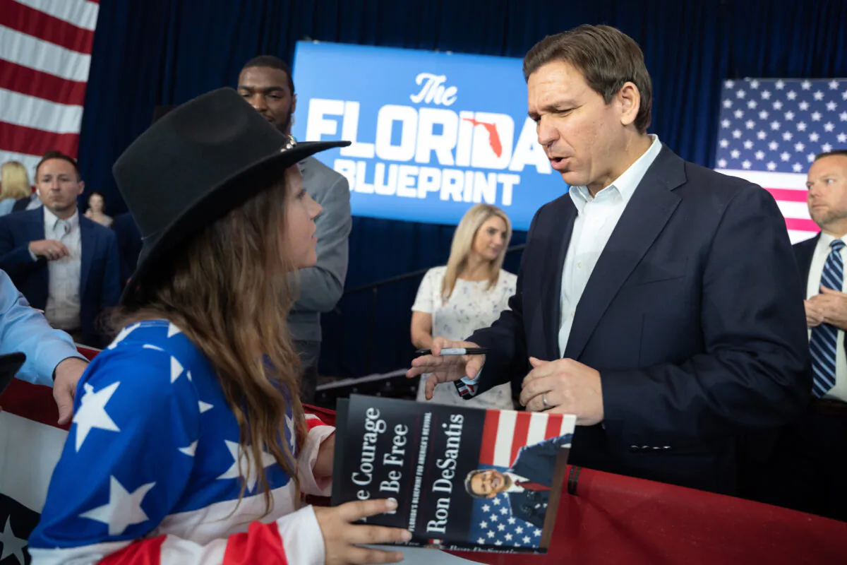 Florida Governor Ron DeSantis reacts after signing a copy of his new book, "The Courage to Be Free: Florida's Blueprint for America's Revival," at the North Charleston Coliseum on April 19, 2023 in North Charleston, South Carolina. (Sean Rayford/Getty Images)