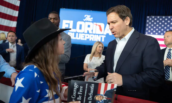 NORTH CHARLESTON, SC - APRIL 19: Florida Governor Ron DeSantis reacts after signing a copy of his new book, "The Courage to Be Free: Florida's Blueprint for America's Revival," at the North Charleston Coliseum on April 19, 2023 in North Charleston, South Carolina. The Governor's appearance marks his first official visit to the "First in the South" presidential primary state amid mounting anticipation of his 2024 presidential candidacy. (Photo by Sean Rayford/Getty Images)