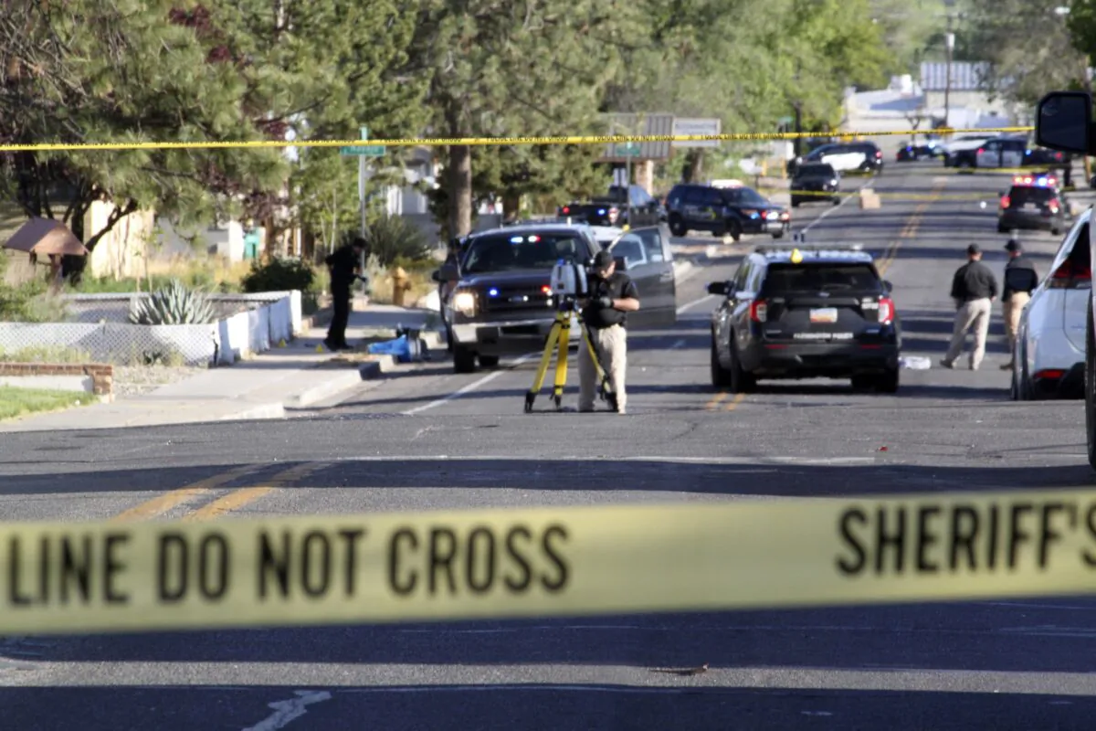 Investigators work along a residential street following a deadly shooting in Farmington, N.M., on May 15, 2023. (Susan Montoya Bryan/AP Photo)
