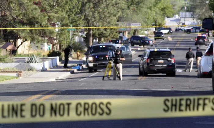 Investigators work along a residential street following a deadly shooting in Farmington, N.M., on May 15, 2023. (Susan Montoya Bryan/AP Photo)