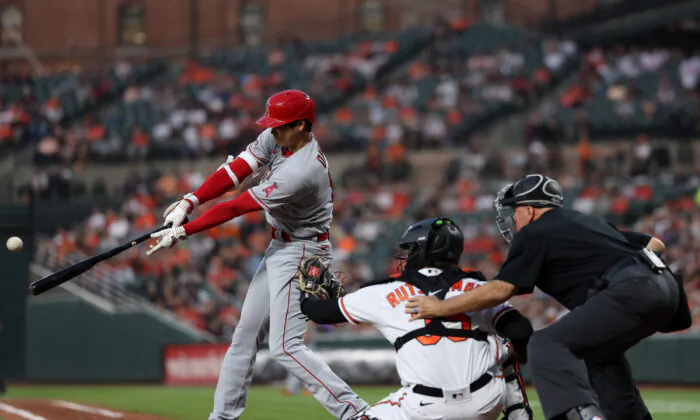 Shohei Ohtani (17) of the Los Angeles Angels hits triple during the fifth inning against the Baltimore Orioles at Oriole Park at Camden Yards in Baltimore on May 15, 2023. (Patrick Smith/Getty Images)
