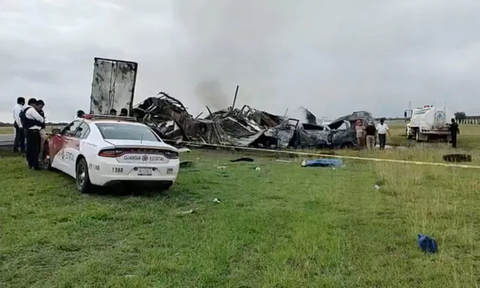 Members of the State Guard gather at the site of a crash, in the Victoria-Zaragoza highway, Tamaulipas, Mexico, on May 14, 2023 in a still from video. (Entorno Informativo Tamaulipas via Reuters)