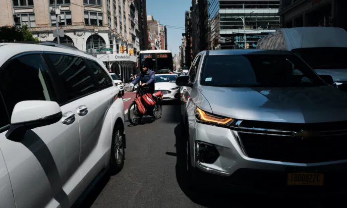 Traffic moves through downtown Manhattan in New York City on April 21, 2023. (Spencer Platt/Getty Images)