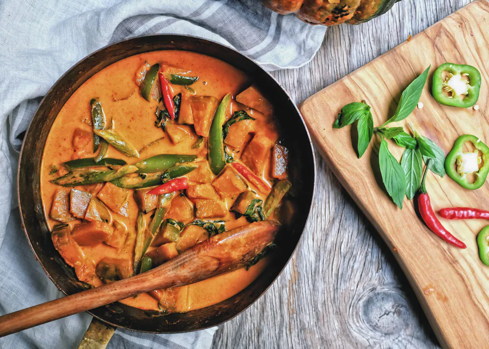 The rich fatty coconut milk balances the intense spices in this red curry. (homelesscuisine/Shutterstock)