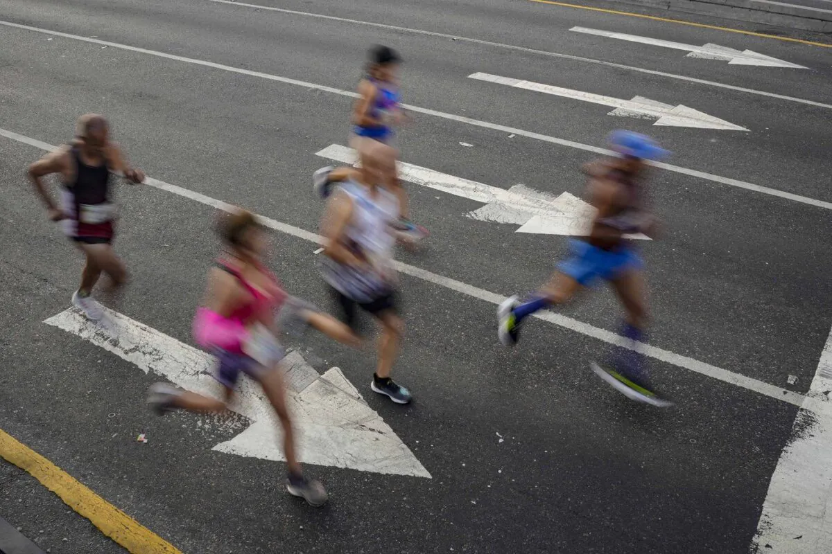 Runners are shown, Dec. 11, 2022 file photo. (The Canadian Press/AP-Matias Delacroix)
