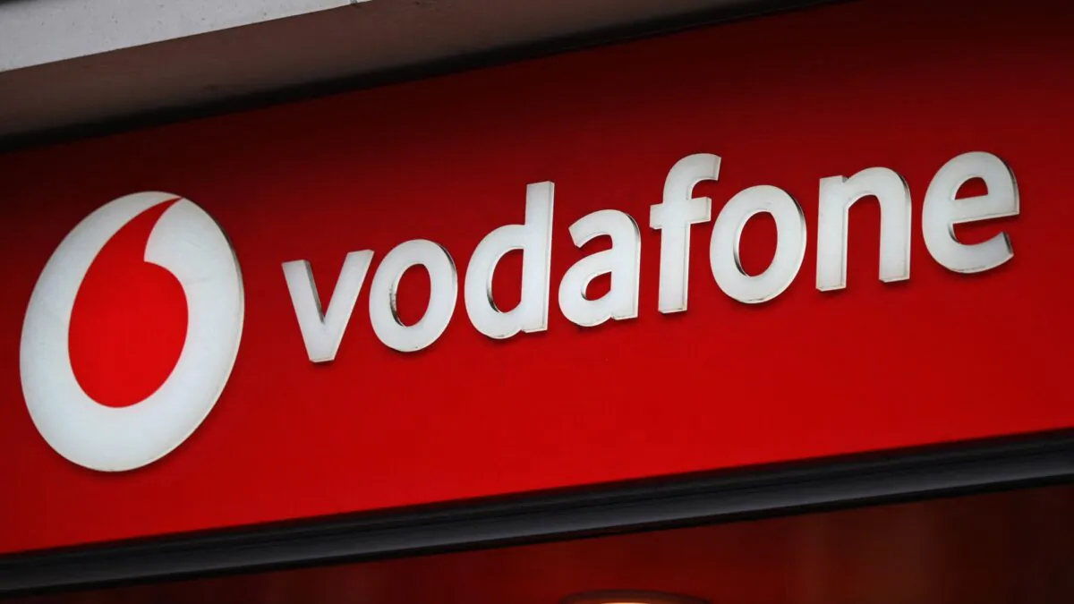 Branding for Vodafone is pictured outside a store in west London, England, on May 15, 2022. (Daniel Leal/AFP via Getty Images)