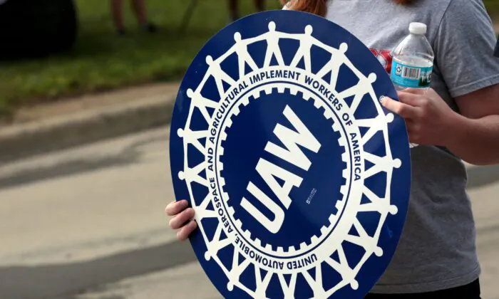 Members of the United Auto Workers (UAW) and supporters picket outside of General Motors Detroit-Hamtramck Assembly in Detroit, Mich., as they strike on Sept. 22, 2019. (Jeff Kowalsky/AFP via Getty Images)
