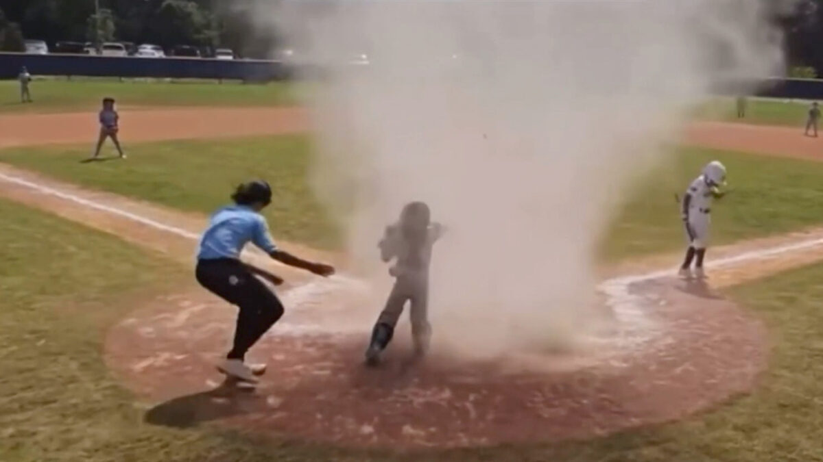 NextImg:‘Dust Devil’ Engulfs Child at Baseball Game